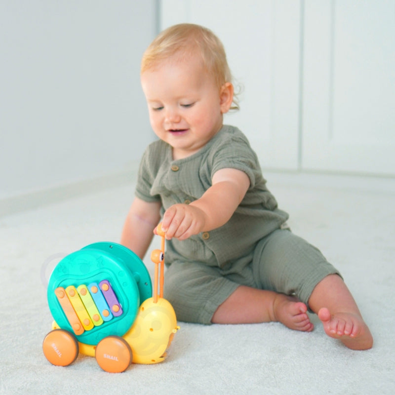 WOOPIE Pulling Snail 4in1 cymbaler Sensory Gears Launcher + liten bil